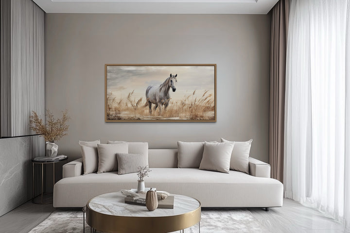 Farm horse in a wheat field farmhouse framed canvas wall art above a modern sofa.