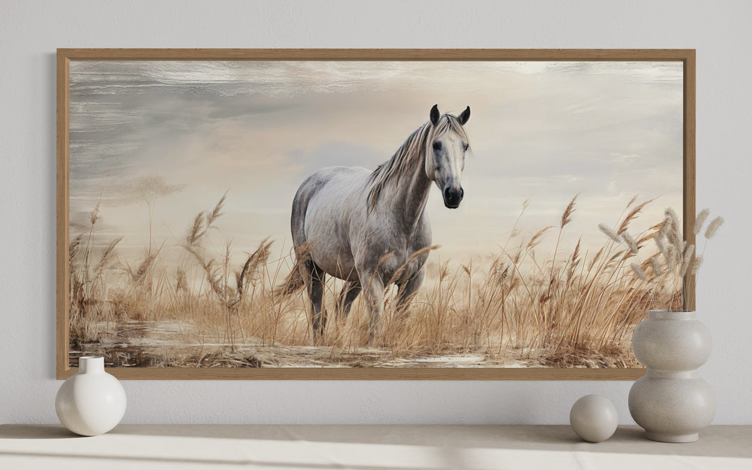 Framed canvas wall art of a white horse standing in a golden wheat field with a rustic wood frame.
