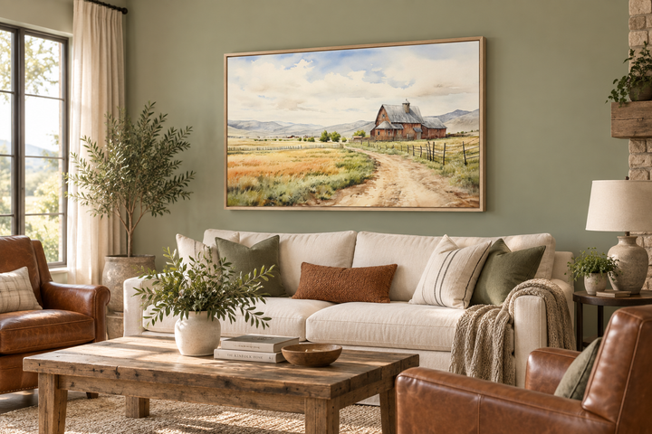 Old barn in a farm field vintage rural framed canvas wall art hanging above a white sofa.