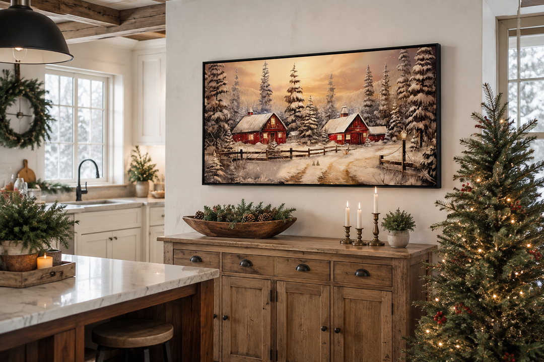 Framed canvas art of red barns in a snowy winter landscape above a rustic wooden sideboard.