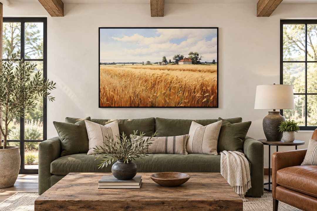 Rustic wheat field landscape farmhouse framed canvas wall art hanging above a green sofa.