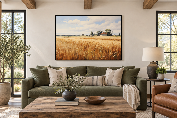 Rustic wheat field landscape farmhouse framed canvas wall art hanging above a green sofa.