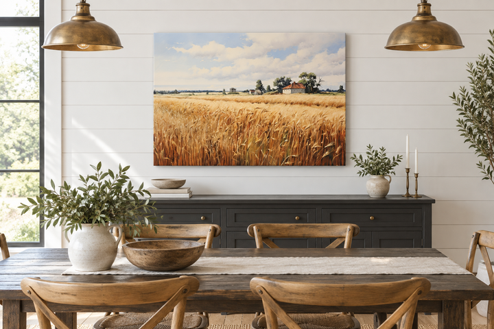Rustic wheat field landscape canvas wall art hanging above a black sideboard in a farmhouse dining.