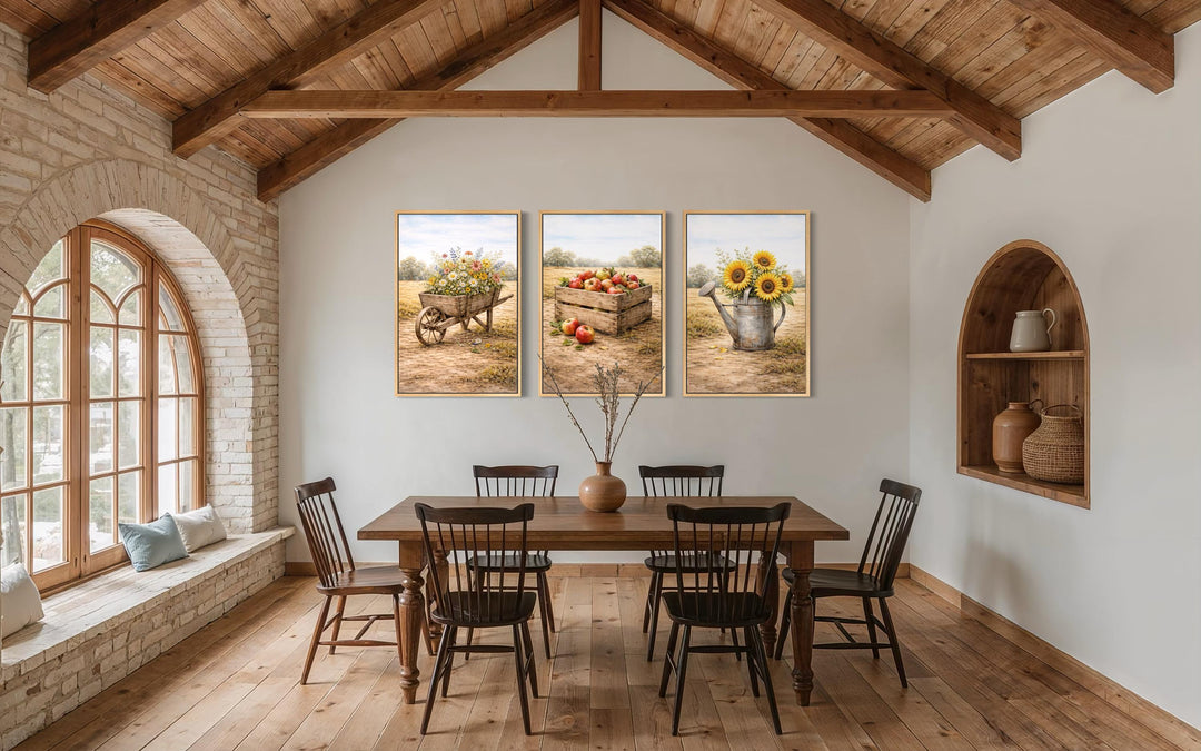 Set of three rustic farmhouse canvas prints featuring sunflowers, apples, and wildflowers.