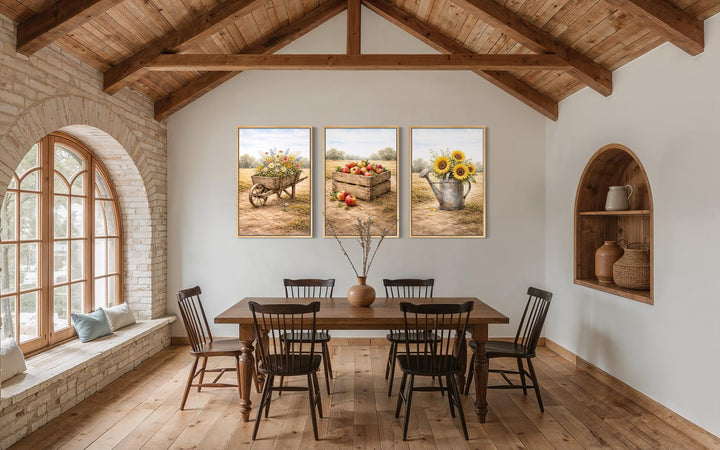 Set of three rustic farmhouse canvas prints featuring sunflowers, apples, and wildflowers.