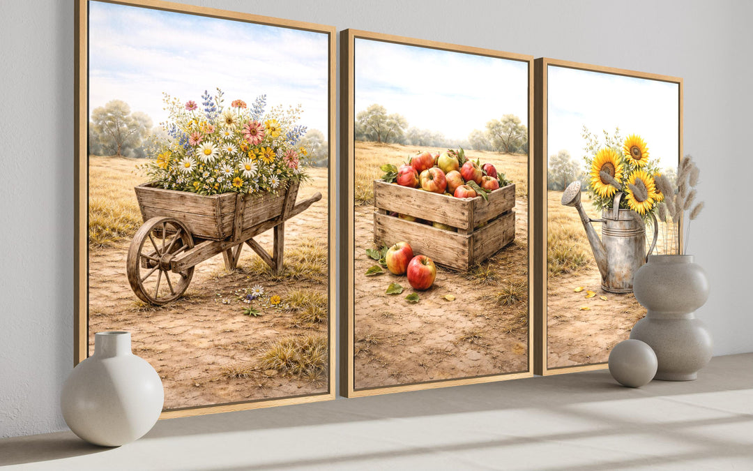 Set of three rustic farmhouse canvas prints featuring a wheelbarrow, apple crate, and sunflowers.