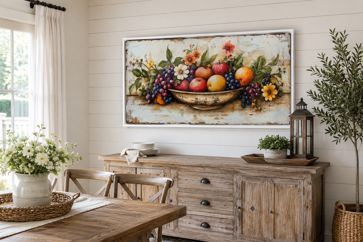 Rustic fruit bowl painting on wood canvas print in a farmhouse dining room above a wooden sideboard.