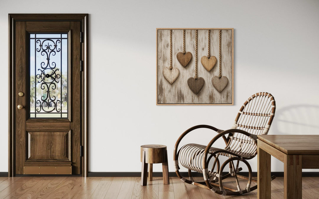 Rustic heart canvas wall art featuring five wooden hearts hanging against whitewashed wood.