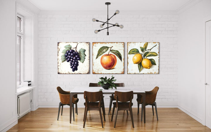 Vintage fruit canvas triptych featuring grapes, a peach, and lemons in a farmhouse dining room.