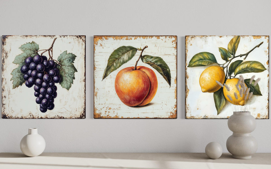 Vintage fruit canvas triptych featuring grapes, a peach, and lemons in a farmhouse kitchen style.