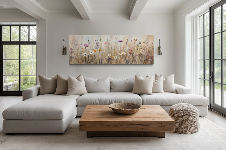 Neutral wildflower field horizontal framed canvas wall art above a sofa in a farmhouse living room.