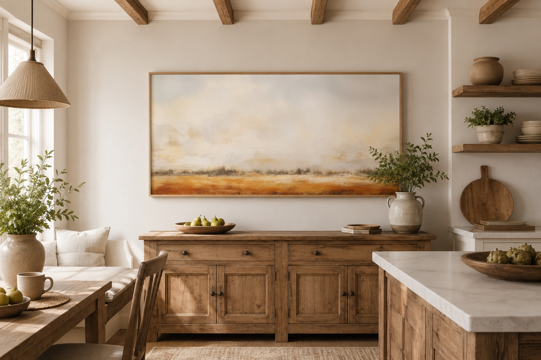Minimalist farm field canvas art in a neutral rustic landscape style hanging in a farmhouse kitchen.