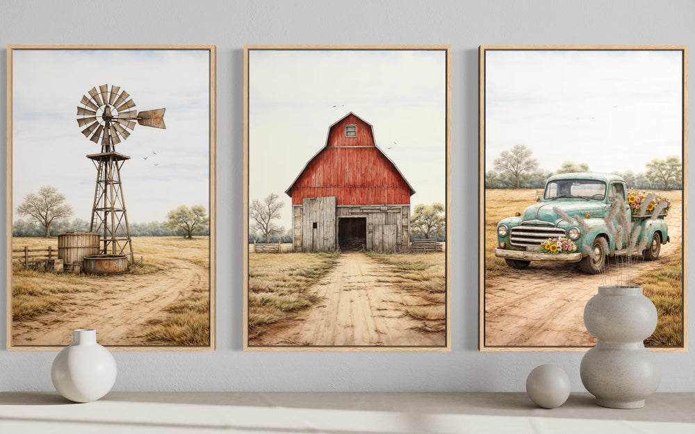 Three framed canvas prints featuring a rustic red barn, a metal windmill, and a vintage blue truck.