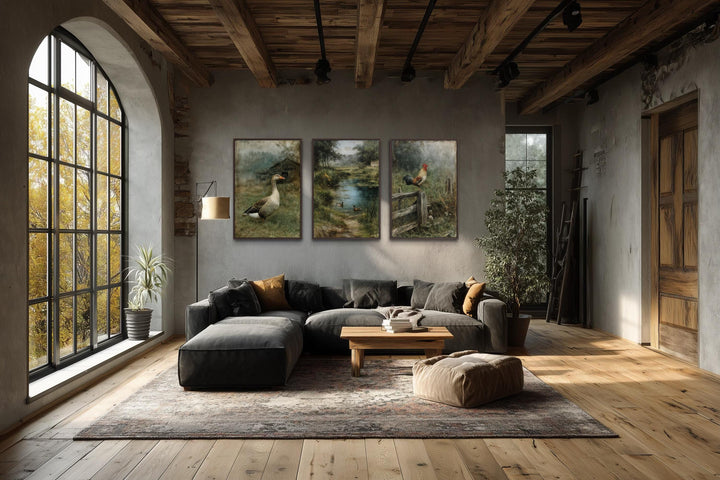 Three framed farmhouse paintings of a goose, ducks on a pond, and a rooster on a fence.