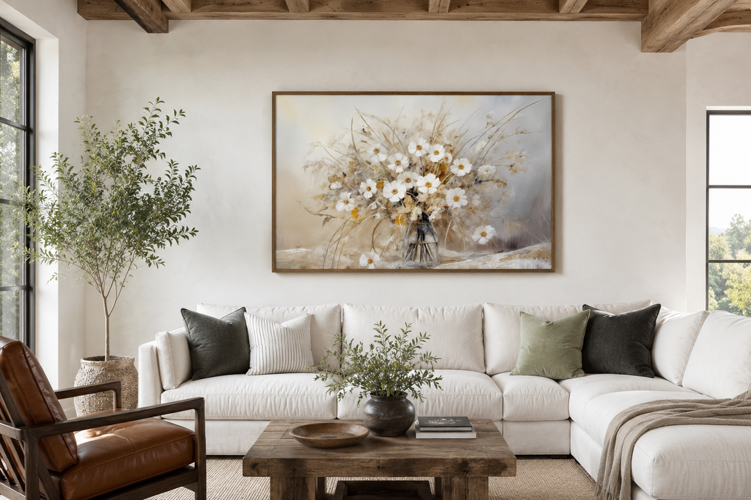 Rustic white wildflowers bouquet framed canvas wall art hanging above a white sectional sofa.