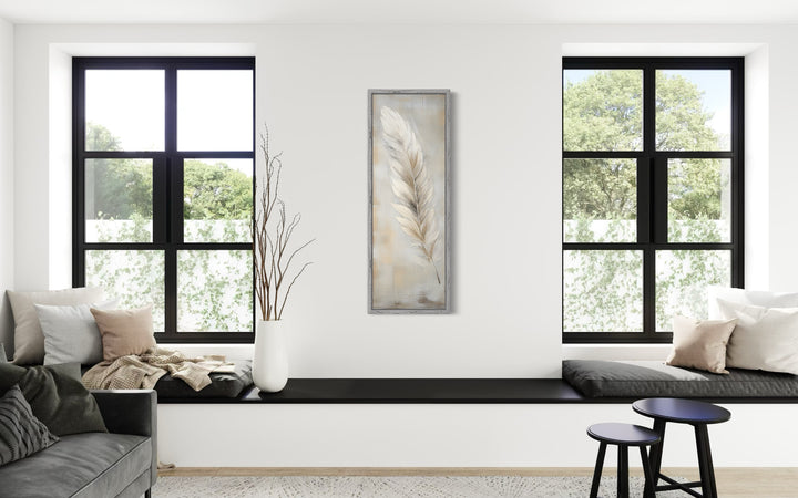 Tall vertical framed canvas wall art featuring a white feather on a rustic wood-textured background.