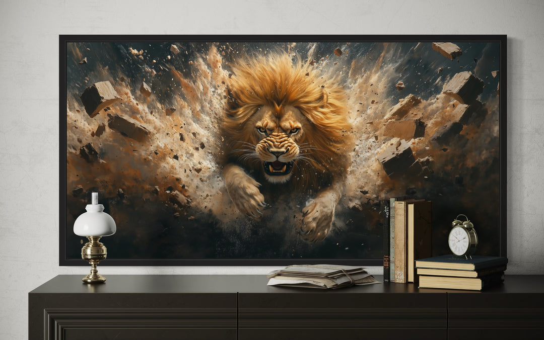 Framed horizontal canvas art of a fierce lion breaking through a brick wall above a dark dresser.