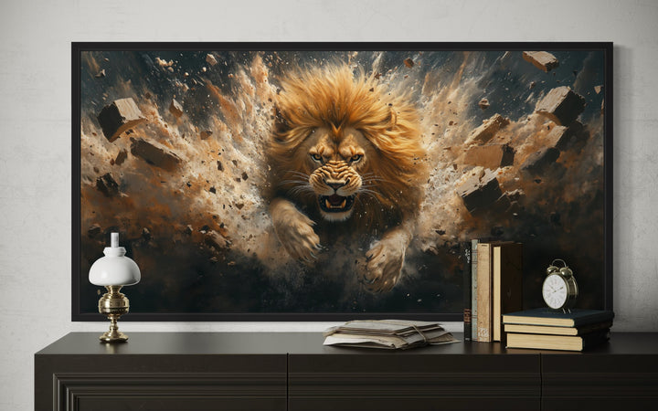 Framed horizontal canvas art of a fierce lion breaking through a brick wall above a dark dresser.