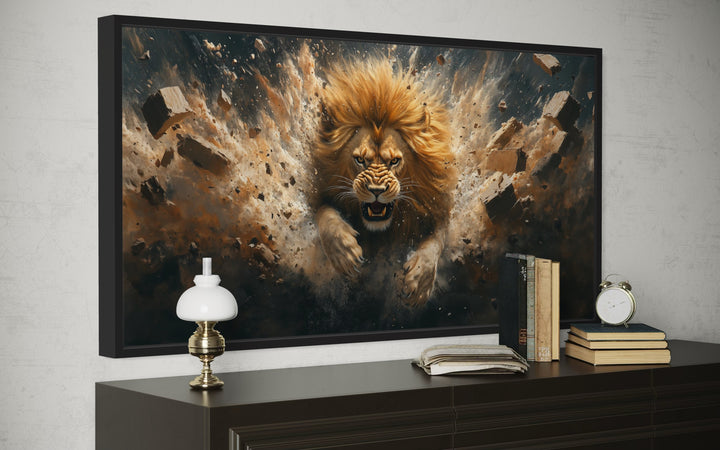 Fierce lion breaking through a brick wall framed canvas art above a dark wood dresser.