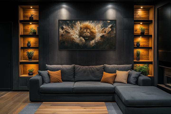 Fierce lion breaking through a brick wall canvas art above a dark grey sectional sofa.