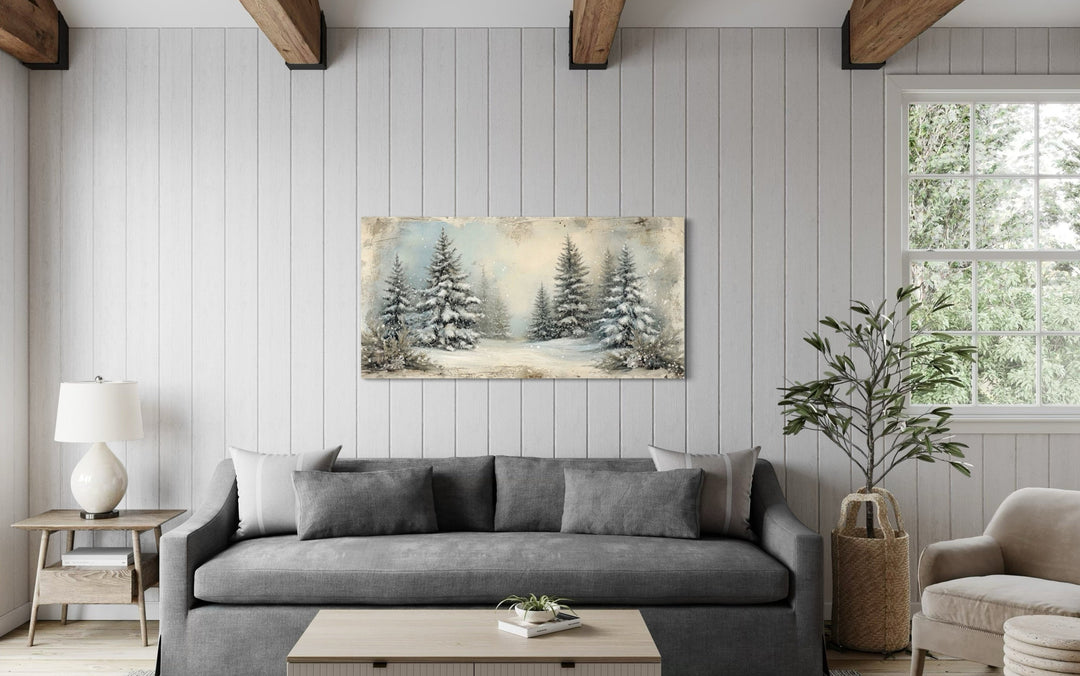 Fir Tree Forest In Winter Framed Canvas Wall Art hanging above a gray sofa in a rustic living room.