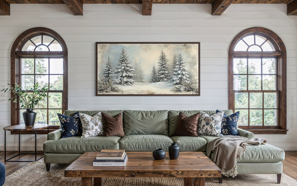 Fir Tree Forest In Winter Framed Canvas Wall Art above a green sofa in a rustic living room.