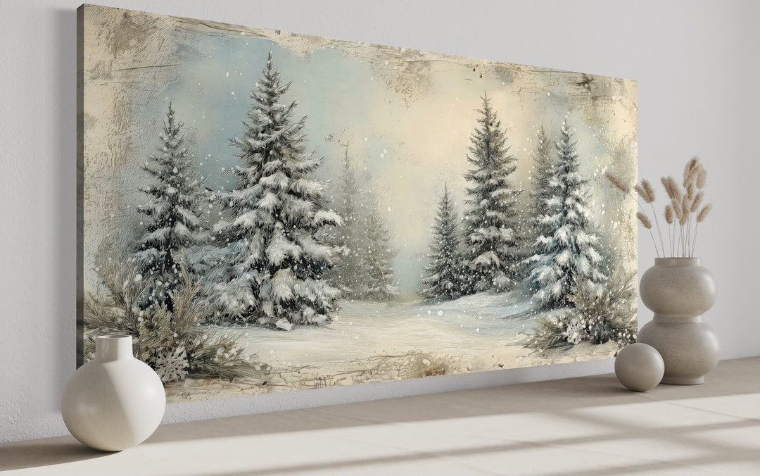 Framed canvas wall art of a snowy fir tree forest in a rustic, retro style with soft winter tones.