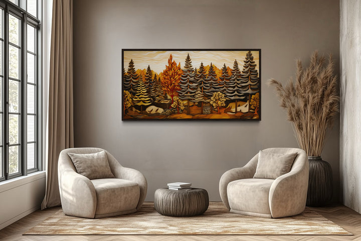 Framed layered wood panel wall art of a fir tree forest in a rustic living room setting.