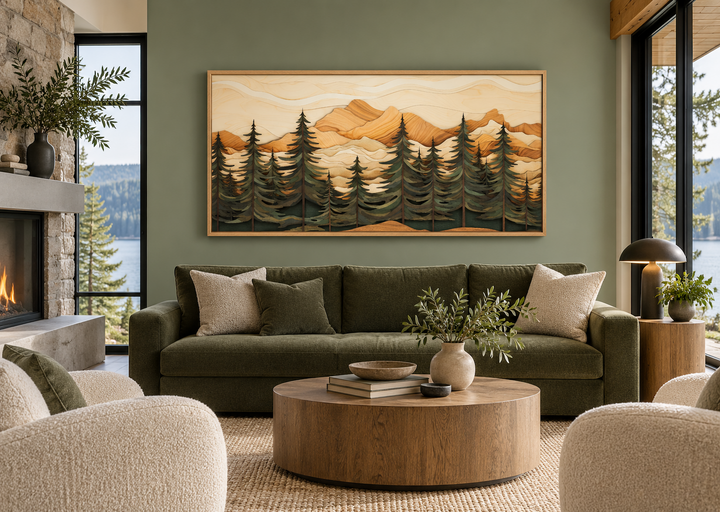 Fir tree forest and mountains wood panel effect framed canvas wall art above a green sofa.