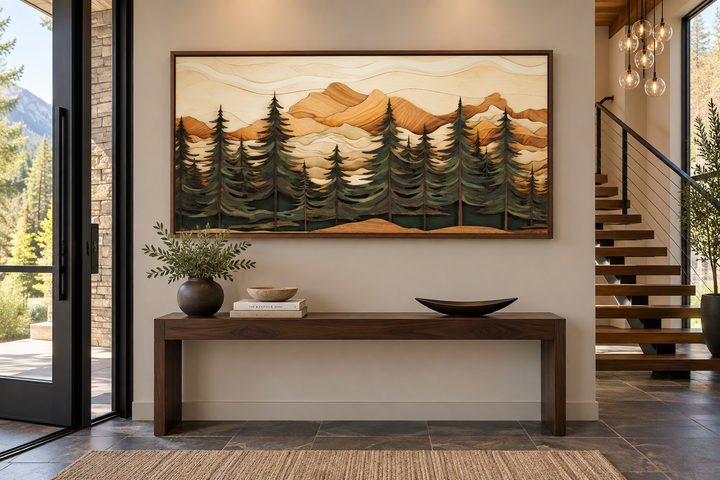 Framed canvas wall art with a wood panel effect showing a fir tree forest and mountain landscape.