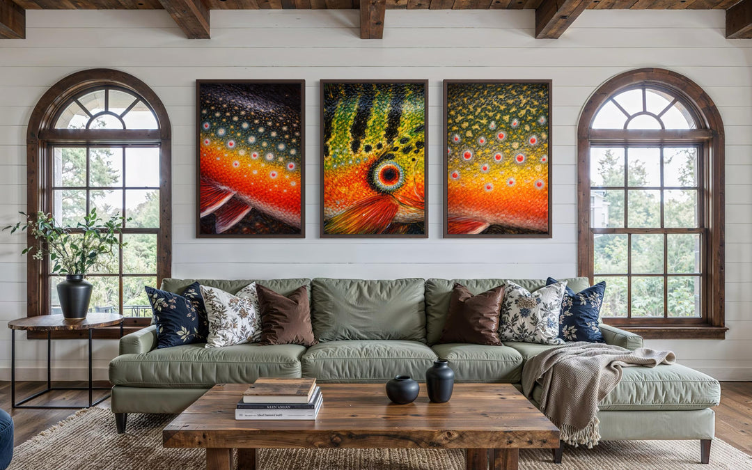 Set of three framed fish skin wall art panels featuring Arctic char, peacock bass, and brook trout for fishing cabin decor.