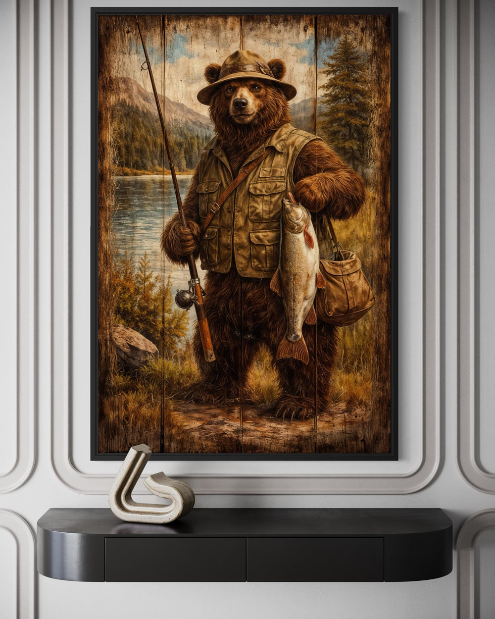 Rustic brown bear fishing wall art in a lodge-style frame above a modern black console table.