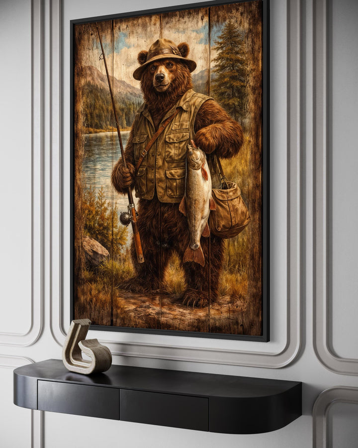 A rustic canvas print of a brown bear dressed as a fisherman, displayed in a modern interior.