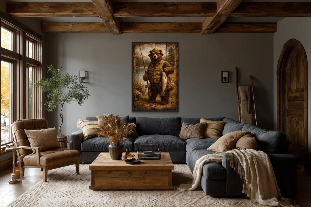 Rustic lodge-style wall art featuring a brown bear dressed as a fisherman in a cozy living room.