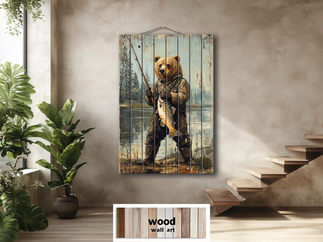 Rustic wood wall art featuring a distressed print of a bear in fishing gear holding a large fish.