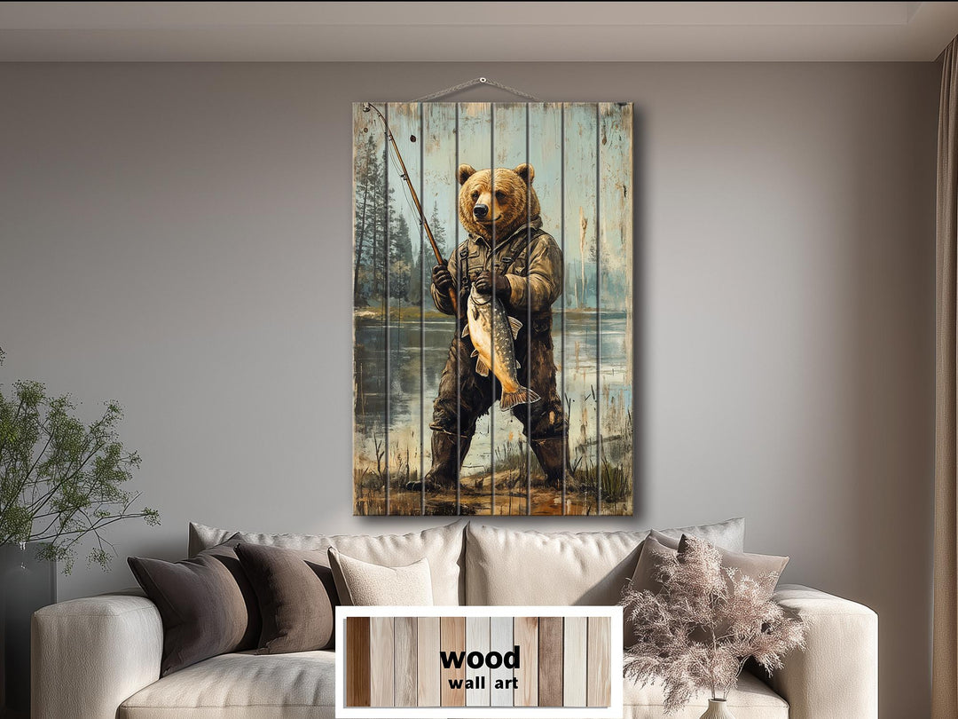 Rustic wood wall art featuring a bear in fishing gear holding a fish, hanging above a sofa.