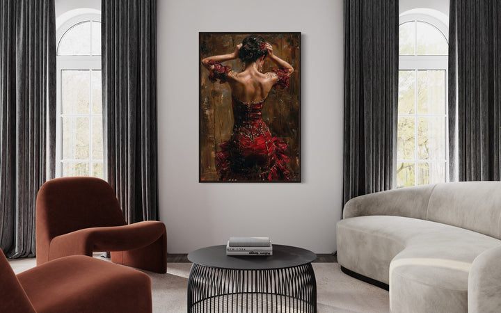 Framed canvas wall art of a flamenco dancer in a red dress hanging in a modern living room.