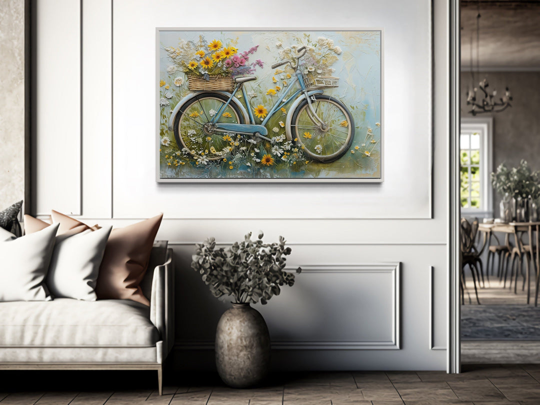 Floral bicycle rustic farmhouse framed canvas wall art hanging in a bright, modern living room.