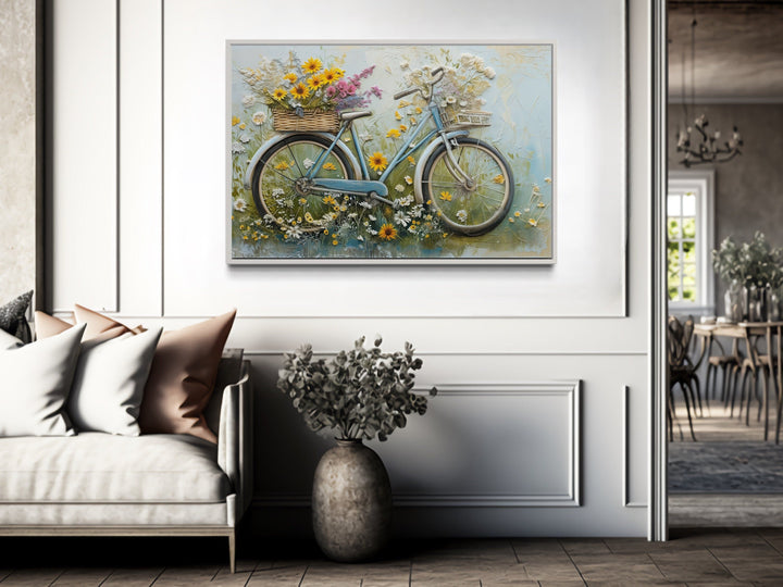 Floral bicycle rustic farmhouse framed canvas wall art hanging in a bright, modern living room.