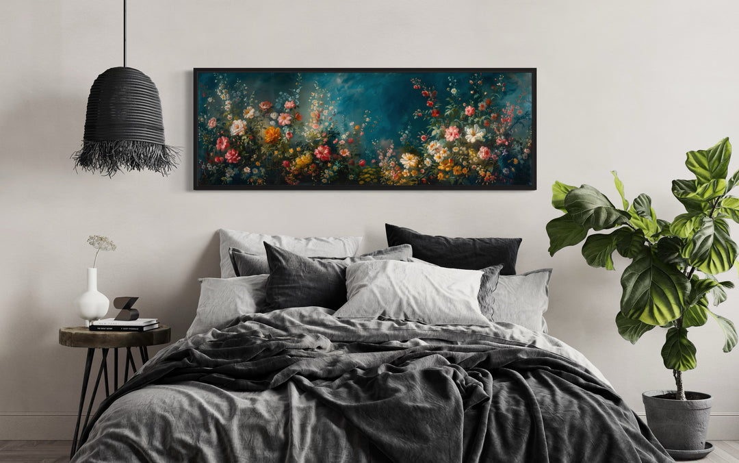 Long narrow canvas wall art of a floral garden on a teal background above a bed.