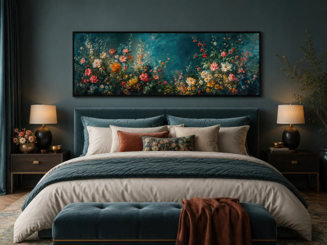 Long narrow canvas wall art featuring a floral garden on a deep teal background above a bed.