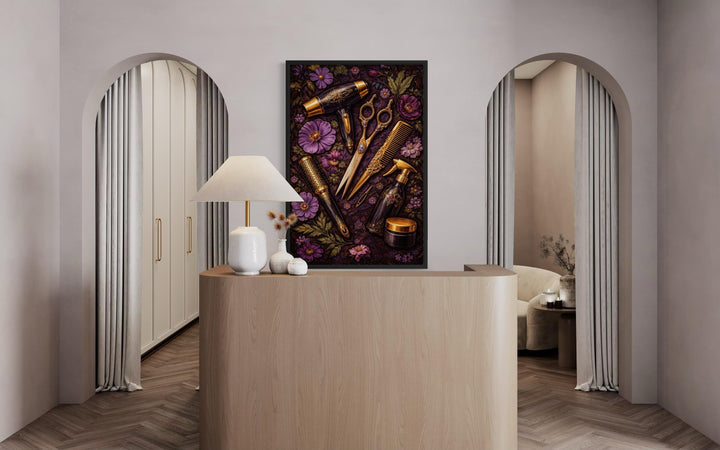 Floral hair salon wall art featuring golden hairdresser tools and purple flowers in a black frame.