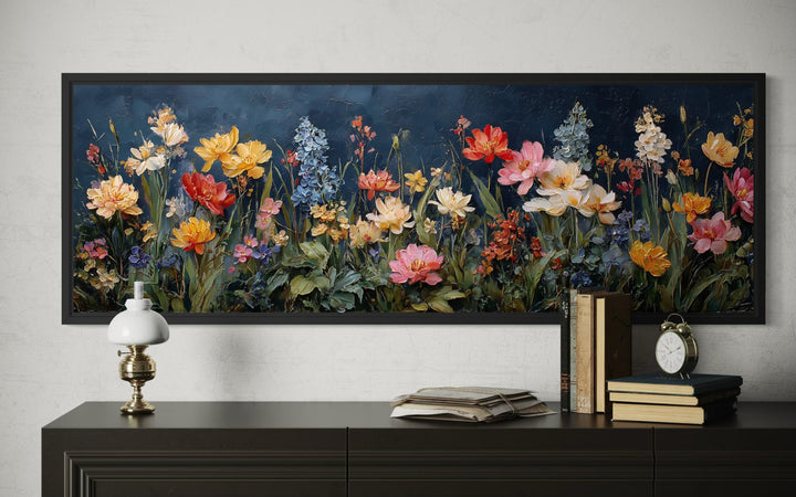 A long horizontal canvas print of a colorful wildflower meadow against a dark navy background.