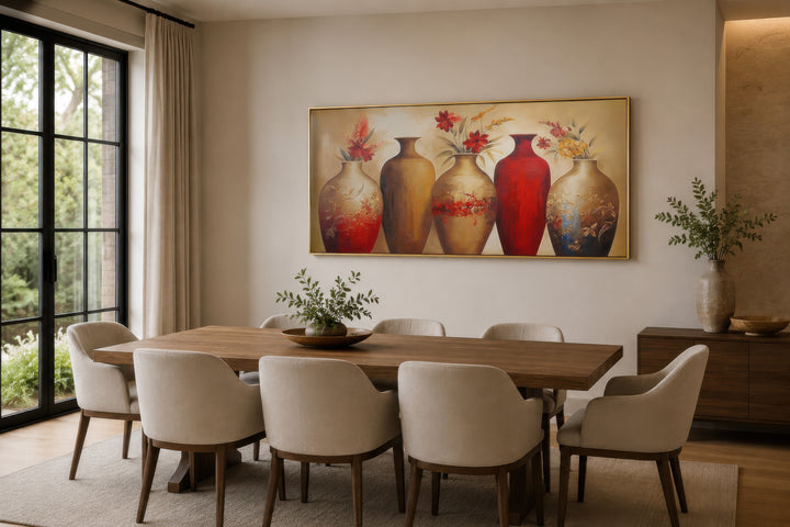 Horizontal canvas wall art featuring five floral vases in red and gold tones above a dining table.