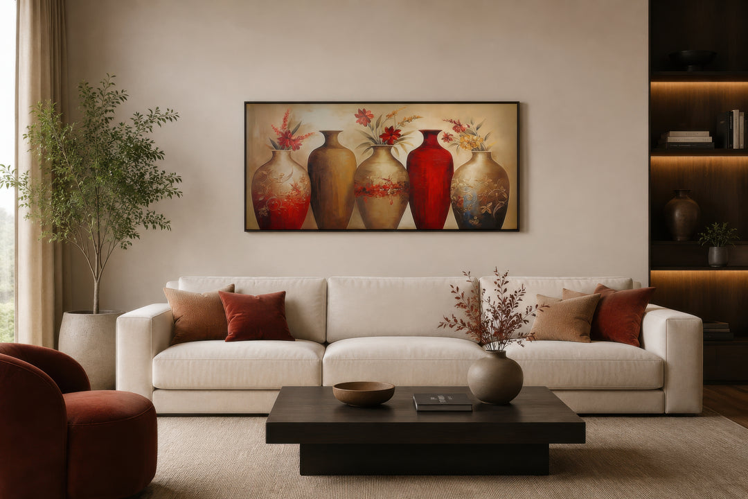 Horizontal canvas wall art featuring five elegant red and gold floral vases above a modern sofa.