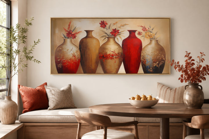 Horizontal canvas wall art featuring five elegant red and gold floral vases in a dining room.