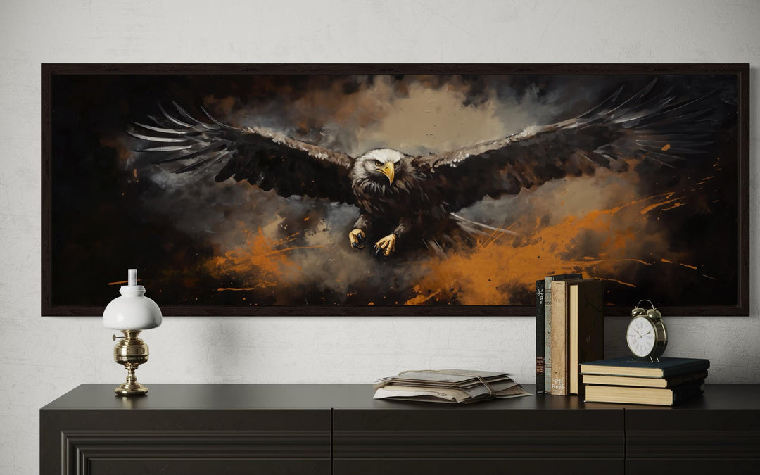 Flying bald eagle horizontal canvas wall art in a dark frame above a black dresser.