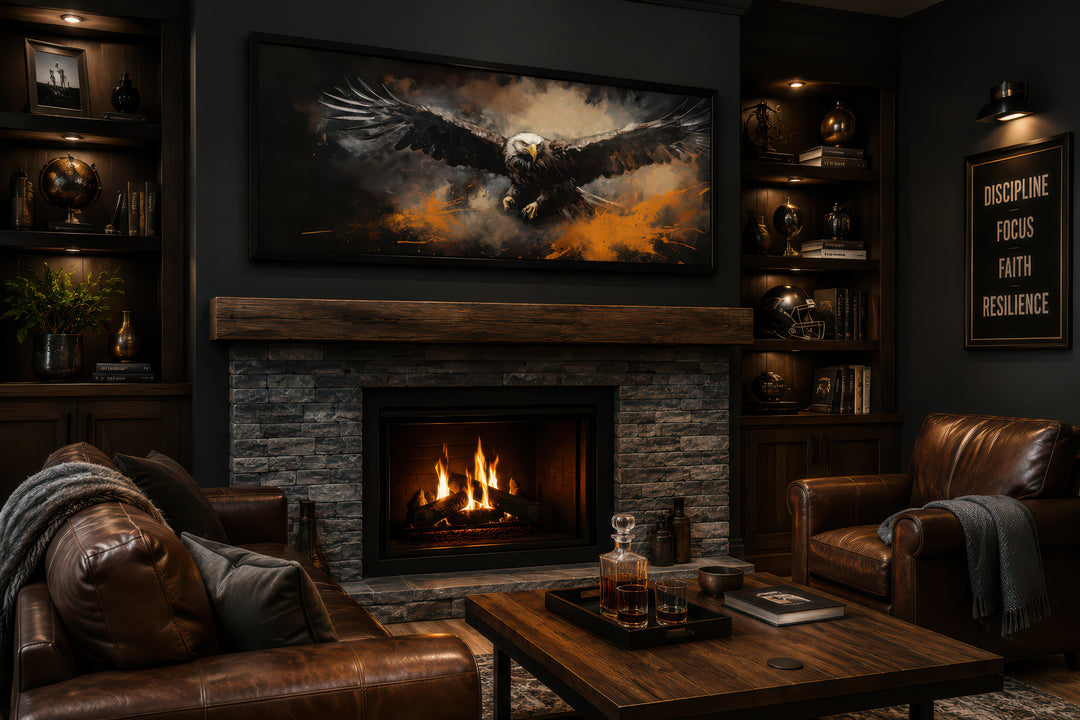 Horizontal canvas wall art of a bald eagle in flight above a fireplace in a dark, masculine room.