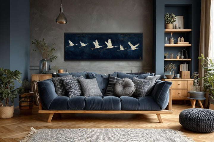 Panoramic navy blue canvas wall art featuring a horizontal procession of flying white cranes.