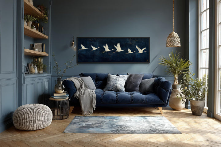 Panoramic navy blue canvas print featuring a horizontal procession of flying white cranes.